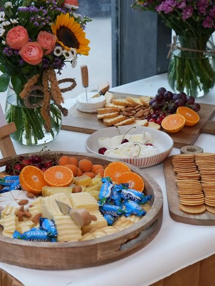 A welcoming cheese board at the Varnya salon launch. This platter features a mix of cheeses, almonds, apricots, and crackers, accented with Boursin cheese portions for an extra touch of flavour.