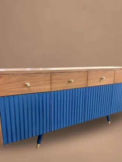 Another angle of the blue and wood sideboard, emphasizing its clean lines and expert craftsmanship. This piece provides ample storage while serving as a beautiful focal point.