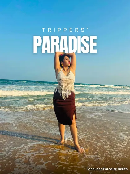 This is a tripper's paradise. A woman stands on Sandunes Paradise Beach in Pondicherry, soaking in the sun and the waves. My trips are designed to help you find your own slice of paradise.