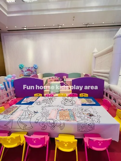 This indoor setup combines our pastel soft play area with our vibrant rainbow chairs. The tables are covered with a fun coloring-sheet tablecloth for an instant activity zone.