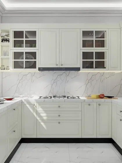 Classic design never goes out of style. This 3D render shows a U-shaped kitchen we designed, featuring timeless white cabinetry with profiled shutters and glass-front doors. Paired with a marble-patterned backsplash and modern appliances, it creates a bright, airy, and elegant space that is both beautiful and practical.