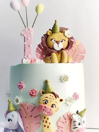 A close-up of the adorable, hand-molded animals from one of my most popular first birthday cake designs.