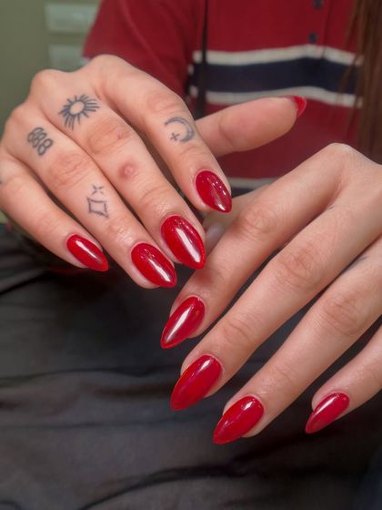 A classic, bold red for the holiday season. This glossy red on a medium almond shape is timeless and perfect for Christmas parties.