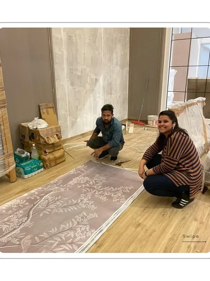 Me on-site, checking the wallpaper roll before installation. This hands-on approach ensures quality and a perfect end result.