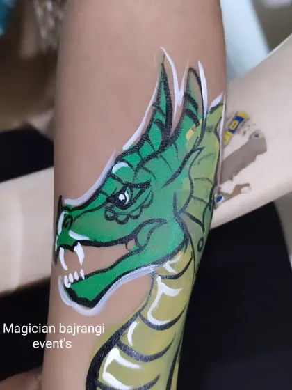 I also paint cool designs like this green dragon. It's a popular request from kids who love fantasy creatures and adventure.