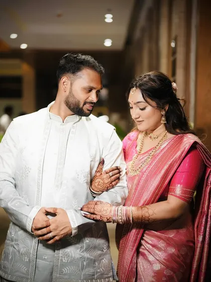A close-up of the couple, showing the bride's glowing skin and simple, elegant jewelry.
