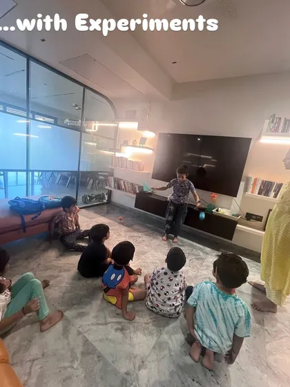 The moment of truth. After making their parachutes, the children tested them to see how they floated down. This experiment made the concept of air resistance tangible and exciting.