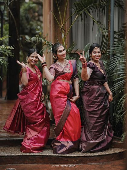 A fun and playful moment with the bride and her bridesmaids, their personalities shining through.