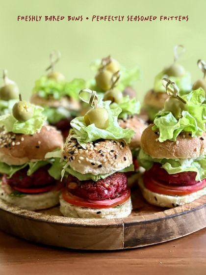 Golden buns, loaded patties, and layers of crunch. I offer a wide variety of patty options for my sliders, including sweet potato and beet, Mexican bean and avocado, veg galouti, and truffle mushroom. There's a flavor for every palate.