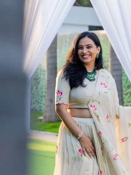 A smiling shot in a beautiful hand-painted lehenga at the JITO Diwali party. This shows how I dress for festive corporate events, blending tradition with a community celebration.