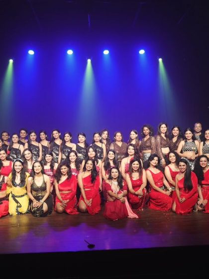 The full cast of a showcase on stage. A beautiful moment capturing the scale of our community and productions.