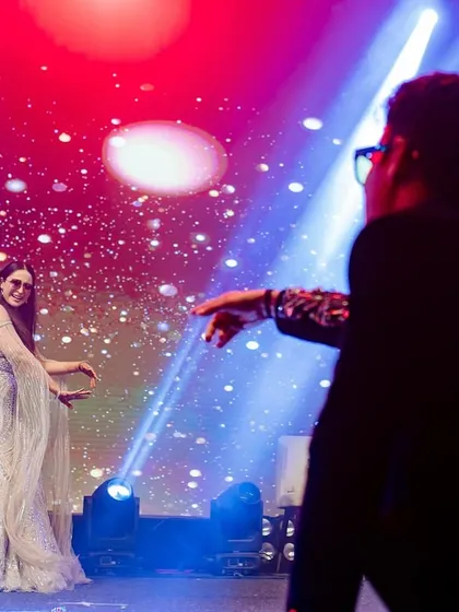A playful interaction between performers on stage. Our choreography encourages fun and expression.