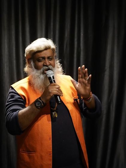 A storyteller captivates the audience at our open mic night. Our stage is a safe space for all forms of expression, from music and comedy to powerful spoken word and poetry.