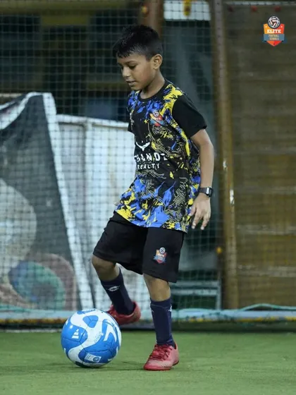 A player practices his first touch, a critical skill for controlling the ball and maintaining possession under pressure.