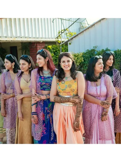 The bride with her bridesmaids, all smiles after the Mehendi. I love choreographing dances for the bride tribe to perform together.