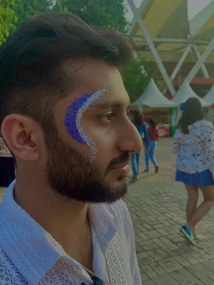 A simple but effective glitter crescent in shades of blue and purple. It's a great way for men to try out glitter art.