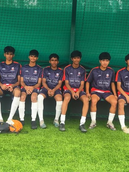 Our U17 players on the bench, ready to be called into action. Team unity is a core part of our philosophy.
