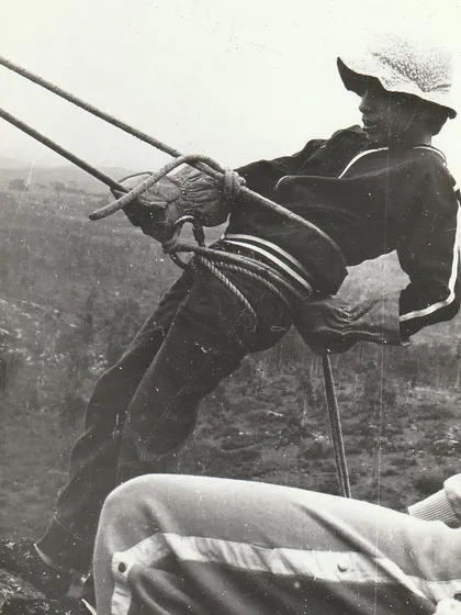 A young climber learning to rappel in the 1980s, using classic techniques. It's amazing to see how the gear has evolved, but the spirit of adventure remains the same.