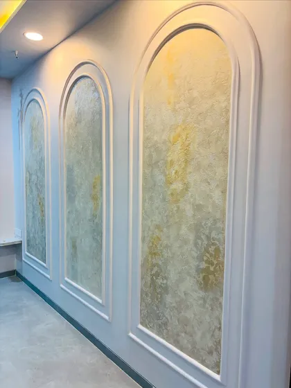 The completed three-panel wall feature, ready for the sofa to be placed.