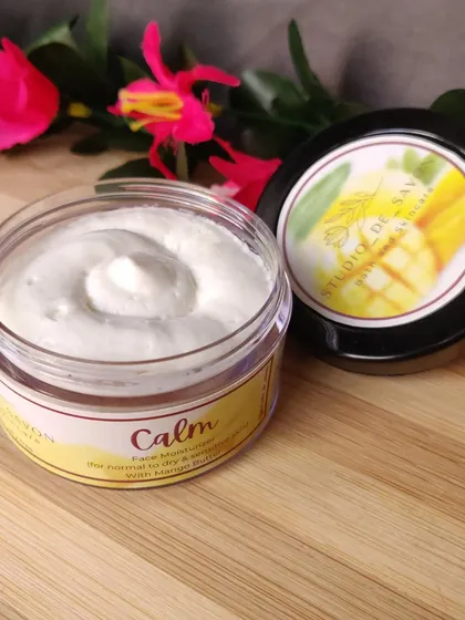 A closer look at the "Calm" face moisturizer. It's formulated with mango butter to calm sensitive skin and provide deep, lasting moisture without feeling heavy.