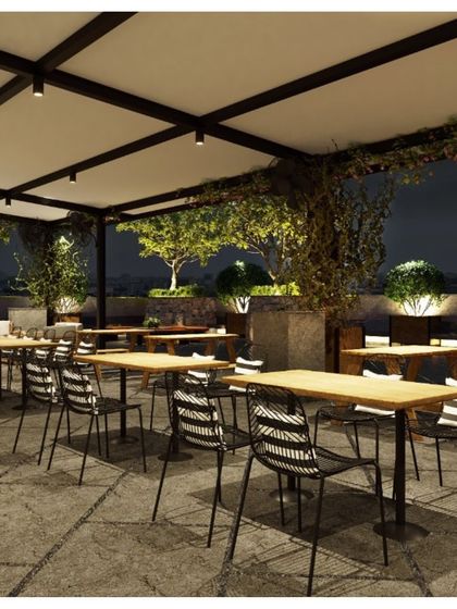 We transformed the terrace of the Pay10 office in New Delhi into an inviting breakout space. This dining area, with its retractable canopy and climbing plants, is perfect for lunches and informal gatherings in any weather.