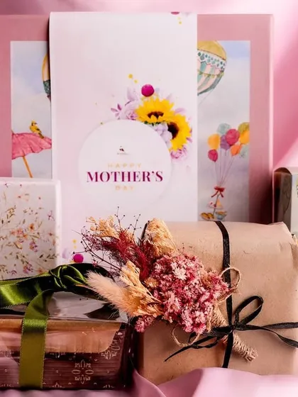 My Mother’s Day Gift Box is a delightful surprise. It includes a tea cake, a box of cookies, a box of lavender bon bons, and a charming jewelry box for her to keep.