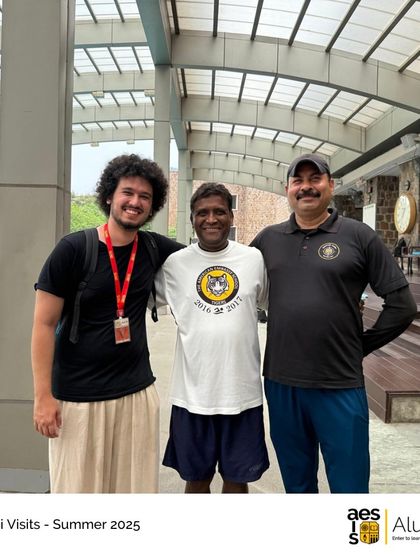 An alumnus visiting for the summer reconnects with our long-serving staff by the pool. These visits highlight the deep sense of belonging that our community members feel.