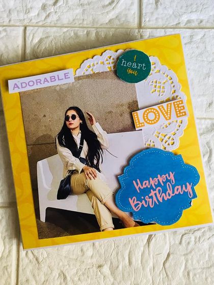 The cover of a bright yellow birthday flipbook. I use a mix of photos, stickers, and die-cuts to create a fun and celebratory design.