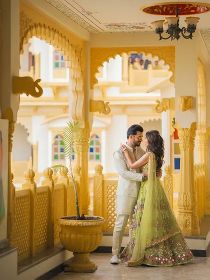 A romantic couple portrait in a beautifully arched heritage hallway during their pre-wedding festivities.