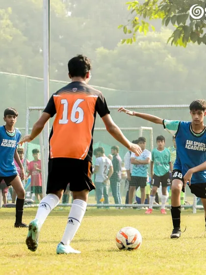 Two players position themselves to receive the ball, anticipating the next play.