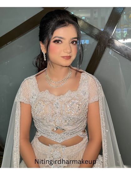 She wanted a beautiful doll look for her engagement, and I think we achieved it. She looks elegant and pretty, ready for her special day.