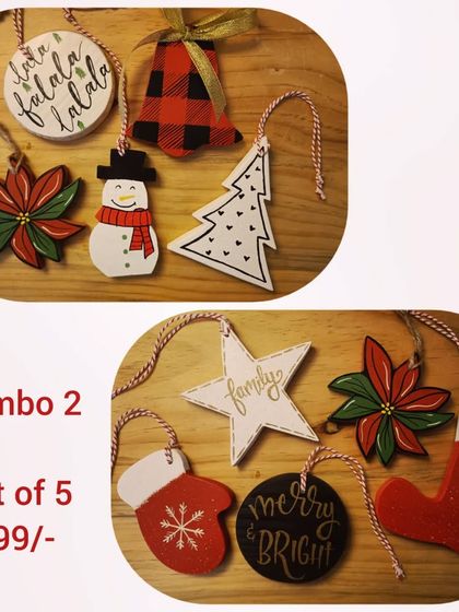 Our Christmas ornament combos make for a perfect festive gift. This set of five includes a mix of hand-painted wooden shapes like a poinsettia, a mitten, and a star.