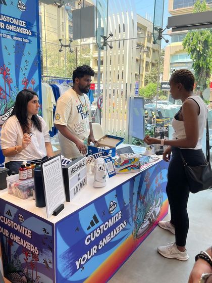 Our live art setup is a hub of activity. We engage with each guest to understand their vision, whether it's a simple initial or a complex design, making the customization process a core part of the event experience.