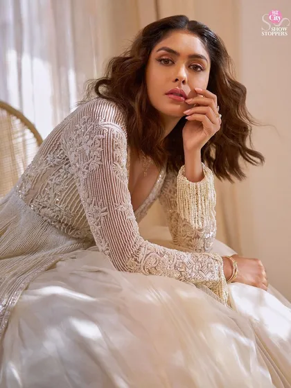 I had the incredible opportunity to be on the styling team for Mrunal Thakur's HT City Showstoppers cover shoot. We created this ethereal look with an ivory skirt and an intricately embellished jacket, balancing Bollywood glamour with her signature understated charm.