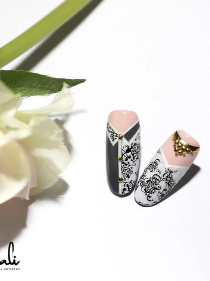 A creative bride and groom nail art set, using stamping and gold studs.