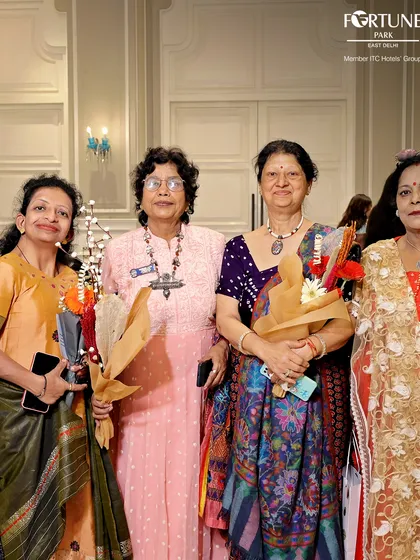 A group of elegantly dressed women enjoying the Women's Day festivities. My events attract a diverse and vibrant crowd, all coming together to celebrate in a stylish and welcoming environment.