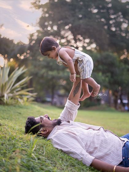 The world from a child's perspective is full of wonder. A father playfully lifts his son into the air during our relaxed outdoor photoshoot, a perfect example of the energetic and loving moments I aim to preserve.