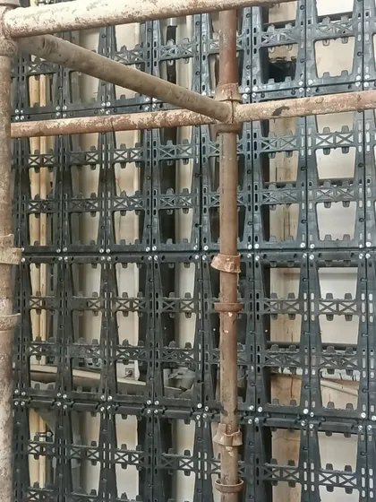 A close-up of the modular panel system during installation. The quality of materials is key to a long-lasting vertical garden.