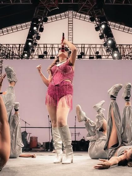 An artistic shot from a low angle, showing the dancers in a unique floor formation around the lead singer. We love creating interesting and memorable stage pictures.