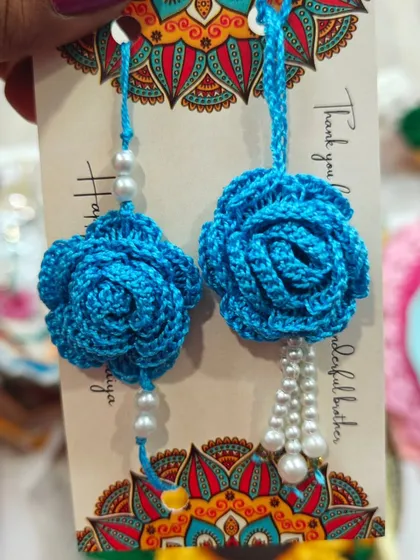 The same beautiful rose lumba rakhi design, here in a stunning shade of blue. A perfect choice for your sister-in-law.