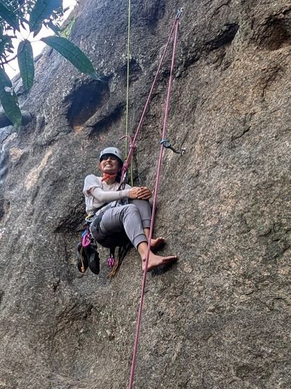 Meet Shivani, a UX designer who started climbing to learn safety skills for trekking. Here she is, resting on a rope, comfortable and happy in the vertical world.