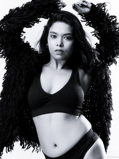 A black and white version of the previous shot, emphasizing the model's form.