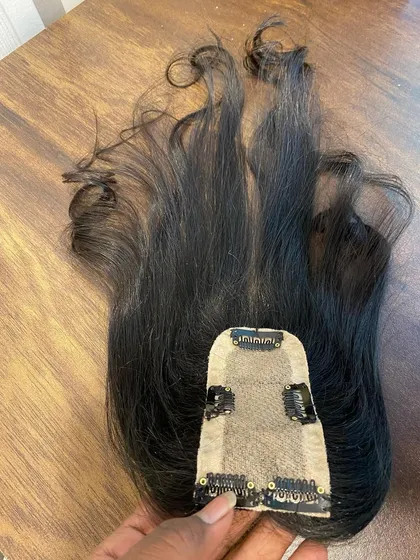 Here is the underside of a 2x5 silk base topper. You can see the secure clips that hold the piece gently but firmly in place without damaging your natural hair.