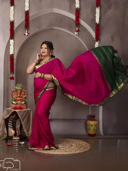 A dynamic shot of the mama-to-be, with the pallu (end piece) of her saree flowing beautifully. It adds a sense of movement and grace.