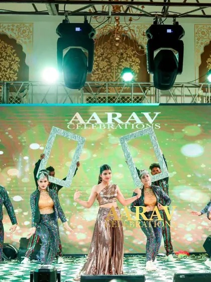 The dancers hold up frames around the performer, creating a unique and artistic visual. This kind of creative prop work is a signature of my choreography services.