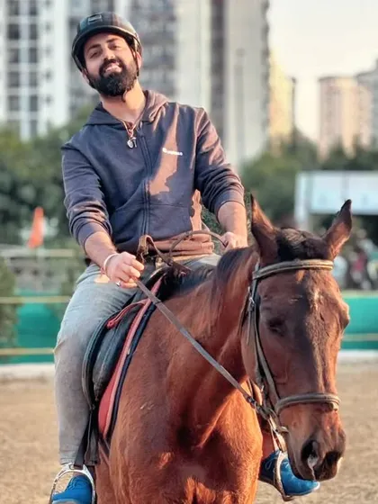 A happy rider enjoying a casual ride in our arena. Our club is a great place for adults to unwind and connect with these beautiful animals.