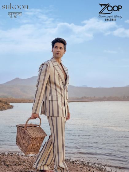 Soft lines, sharp looks. This striped suit from the Sukoon collection is your go-to for festive elegance, offering a smooth silhouette and standout stripes.