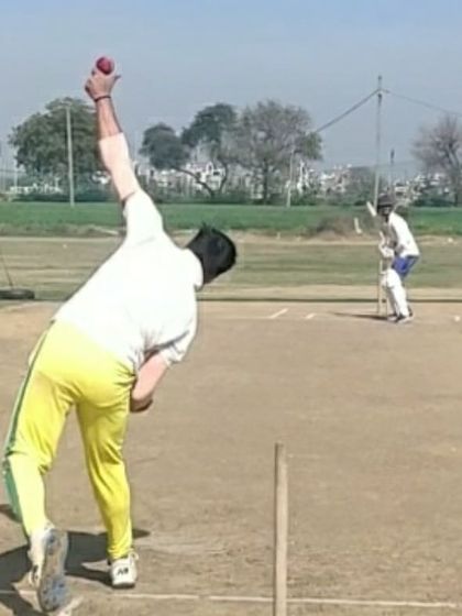 Another example of a good release position for a spinner. A high arm action and good wrist position are things we constantly work on.