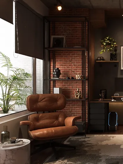 A comfortable reading nook is created with a classic brown leather armchair and a marble side table, set against an exposed brick wall for a raw, industrial feel.