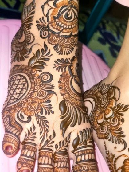 A close-up of an intricate foot design. I love combining geometric patterns with flowing, leafy vines to create a design that is both structured and organic.